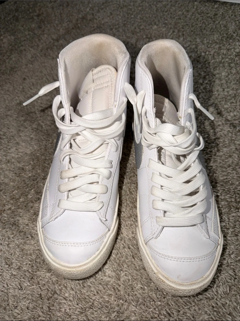 Nike White High-Top Sneakers with Silver Swoosh
